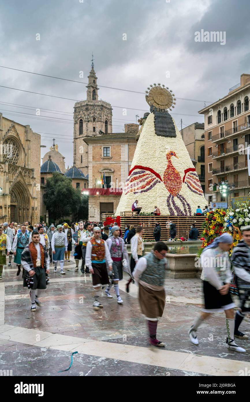 Falleros marching at the flower offering ceremony (ofrena de flors or ofrenda de flores) during the annual Fallas Festival, Valencia, Spain Stock Photo