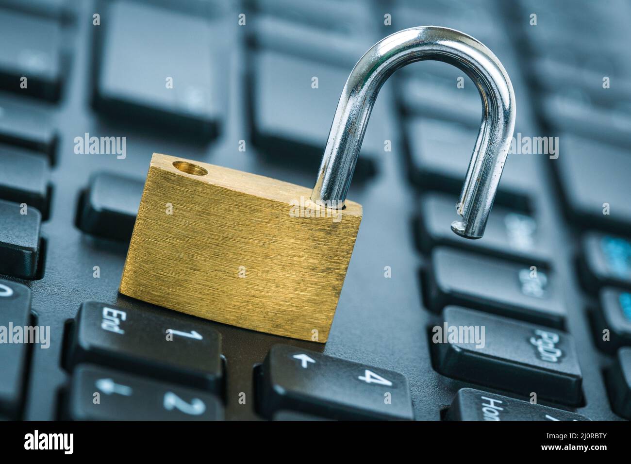 Open security lock on computer keyboard computer security breach