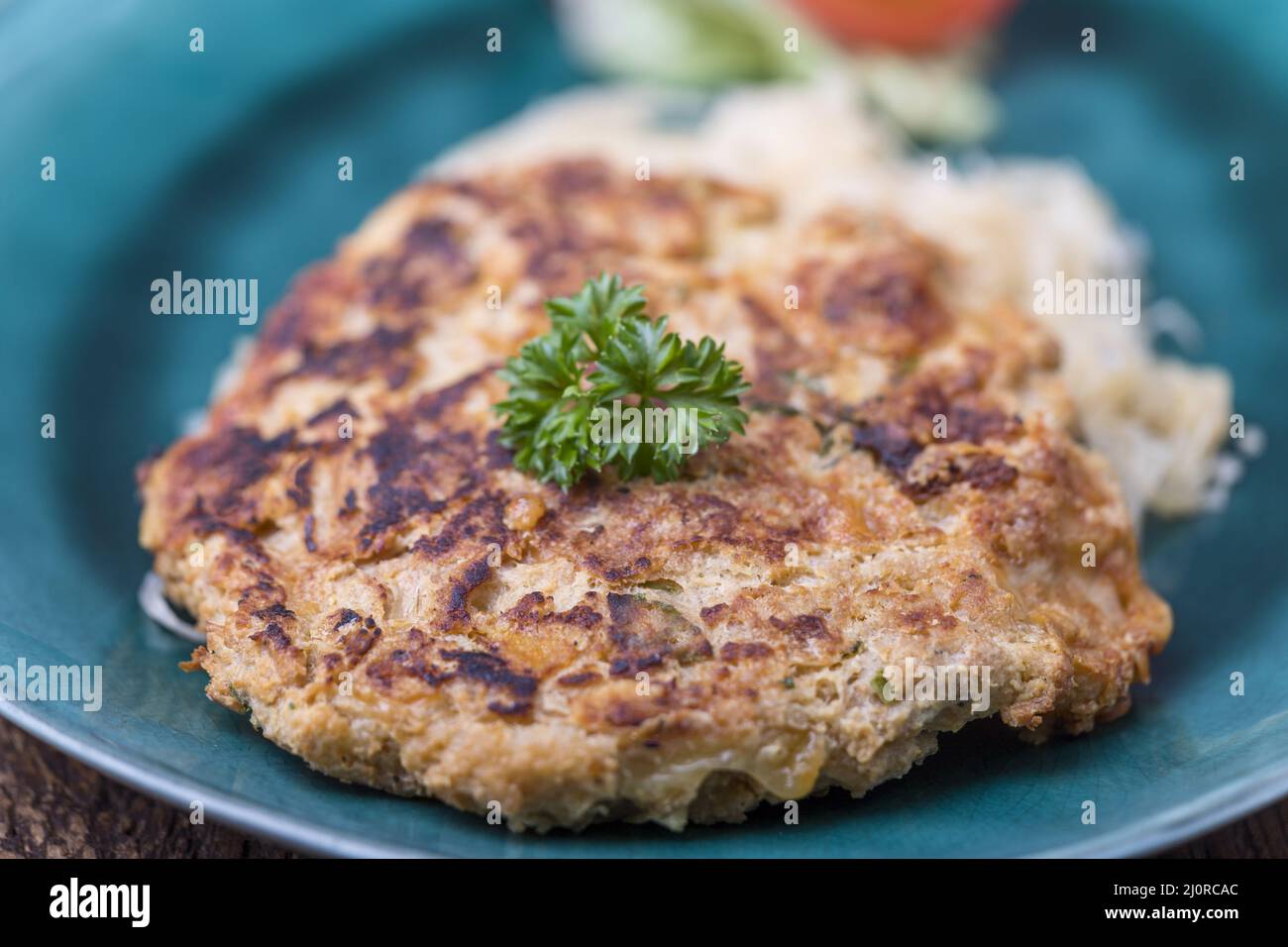 Austrian cheese dumpling with sauerkraut Stock Photo Alamy