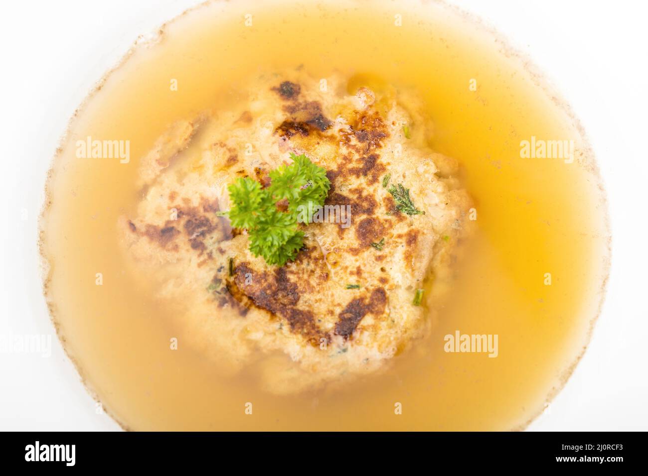Austrian cheese dumpling in broth Stock Photo