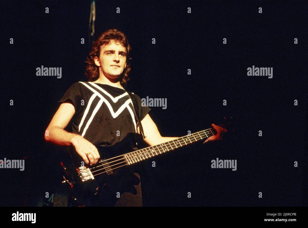 Canadian rock band Saga in concert at Hammersmith Odeon. Pictured, Jim Crichton. 10th November 1983. Stock Photo