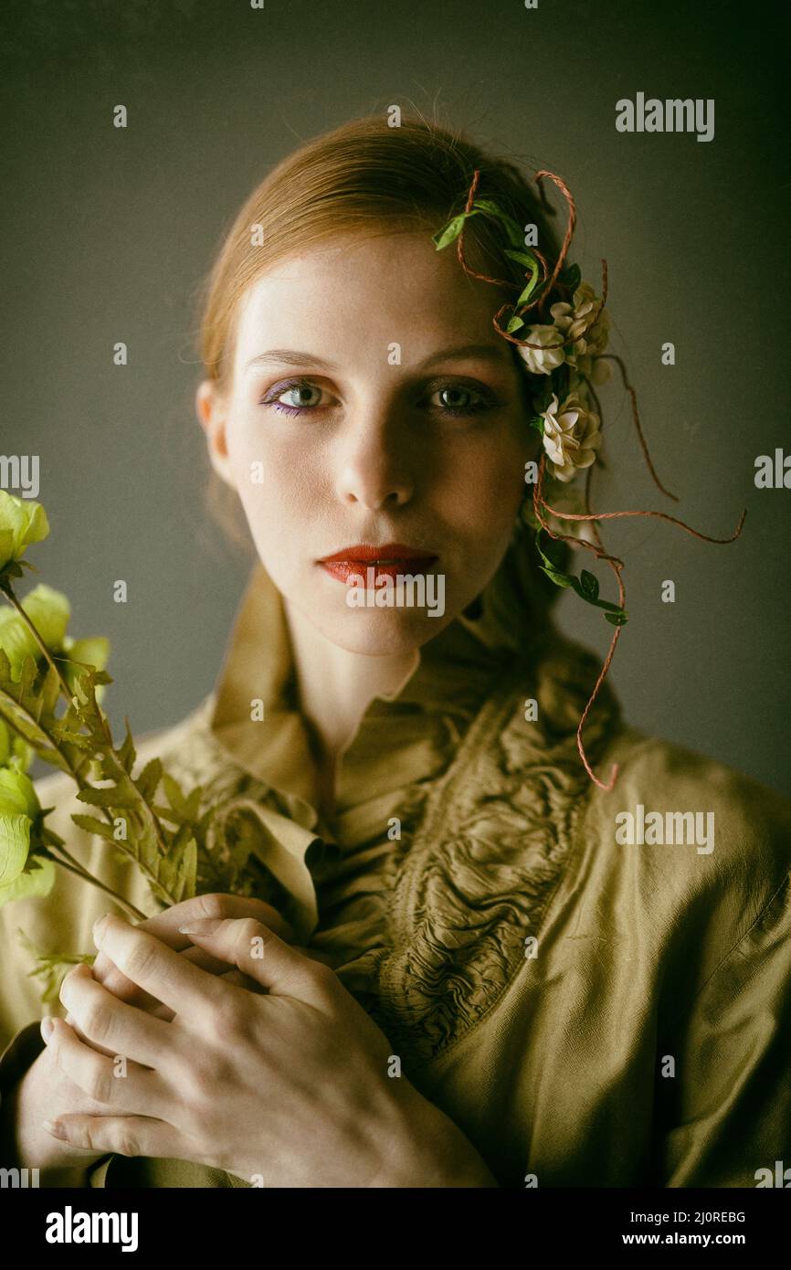 Portrait of a girl with flowers in the hair Stock Photo - Alamy