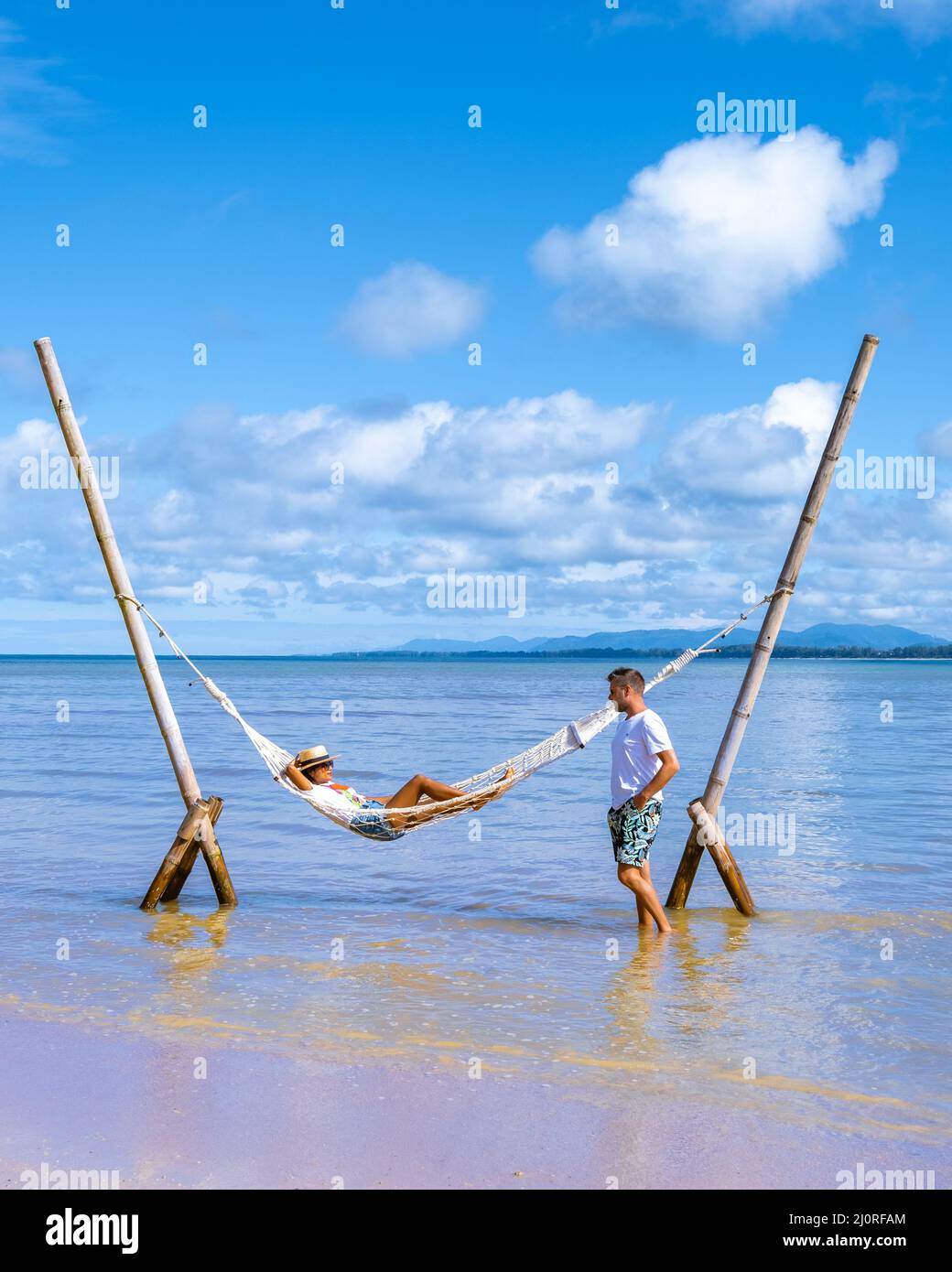 Couple Man And Woman Relaxing In Hammock On The Beach In Phuket Nai Yang Beach Thailand Stock 6135