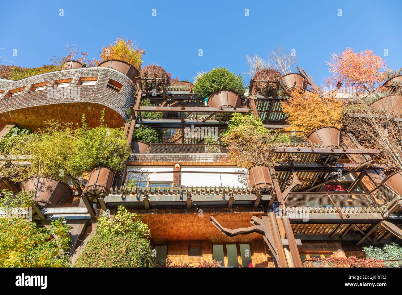 Real estate green residential building in Turin, Italy. Exterior with modern design, plants and wood integrated. Stock Photo