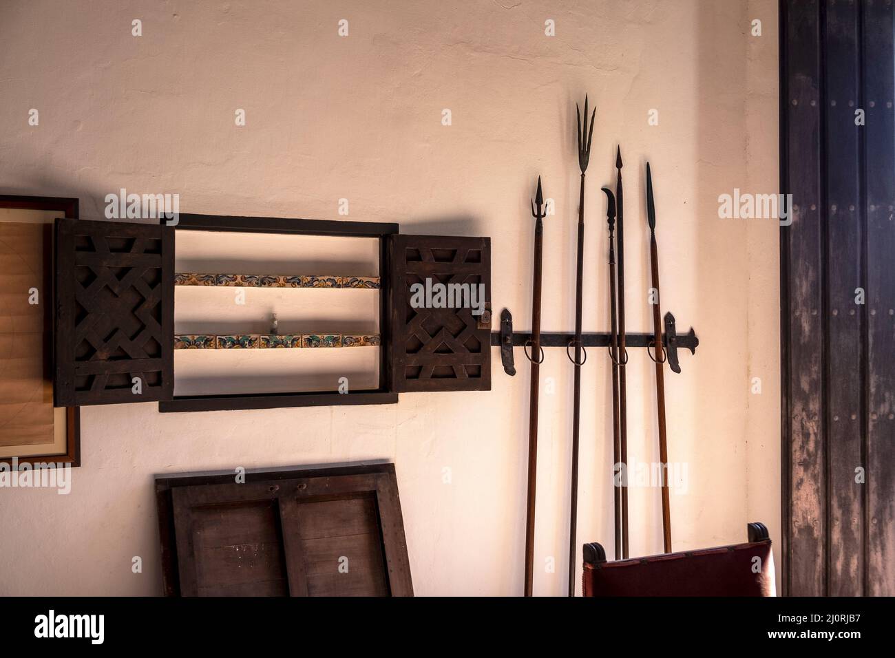 Historical weaponry in a room at La Casa Blanca, home of the Ponce de León family, San Juan