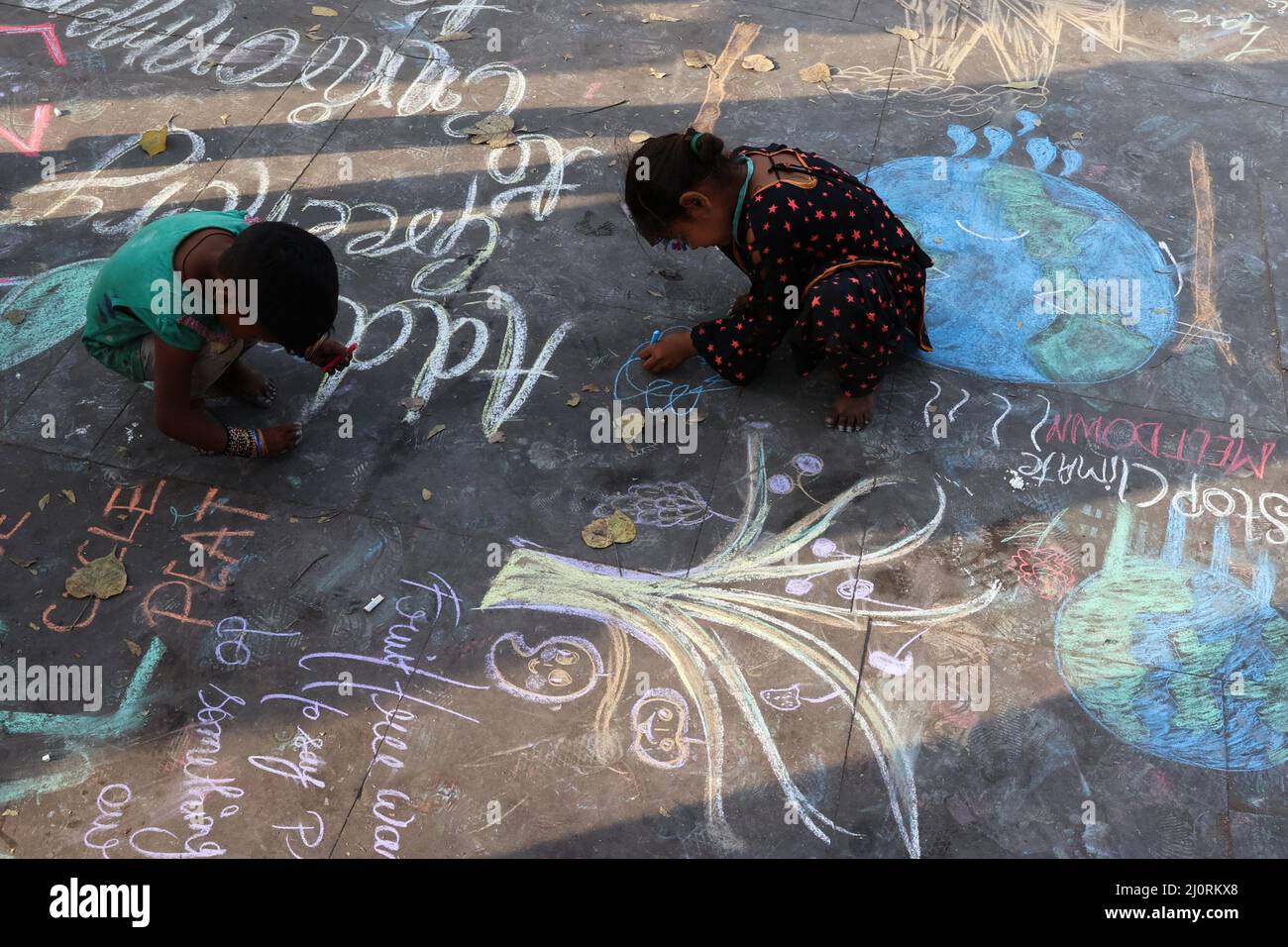 New Delhi, New Delhi, India. 20th Mar, 2022. Kids draw an awareness message calling for urgent measures to combat climate change. (Credit Image: © Karma Sonam Bhutia/ZUMA Press Wire) Stock Photo