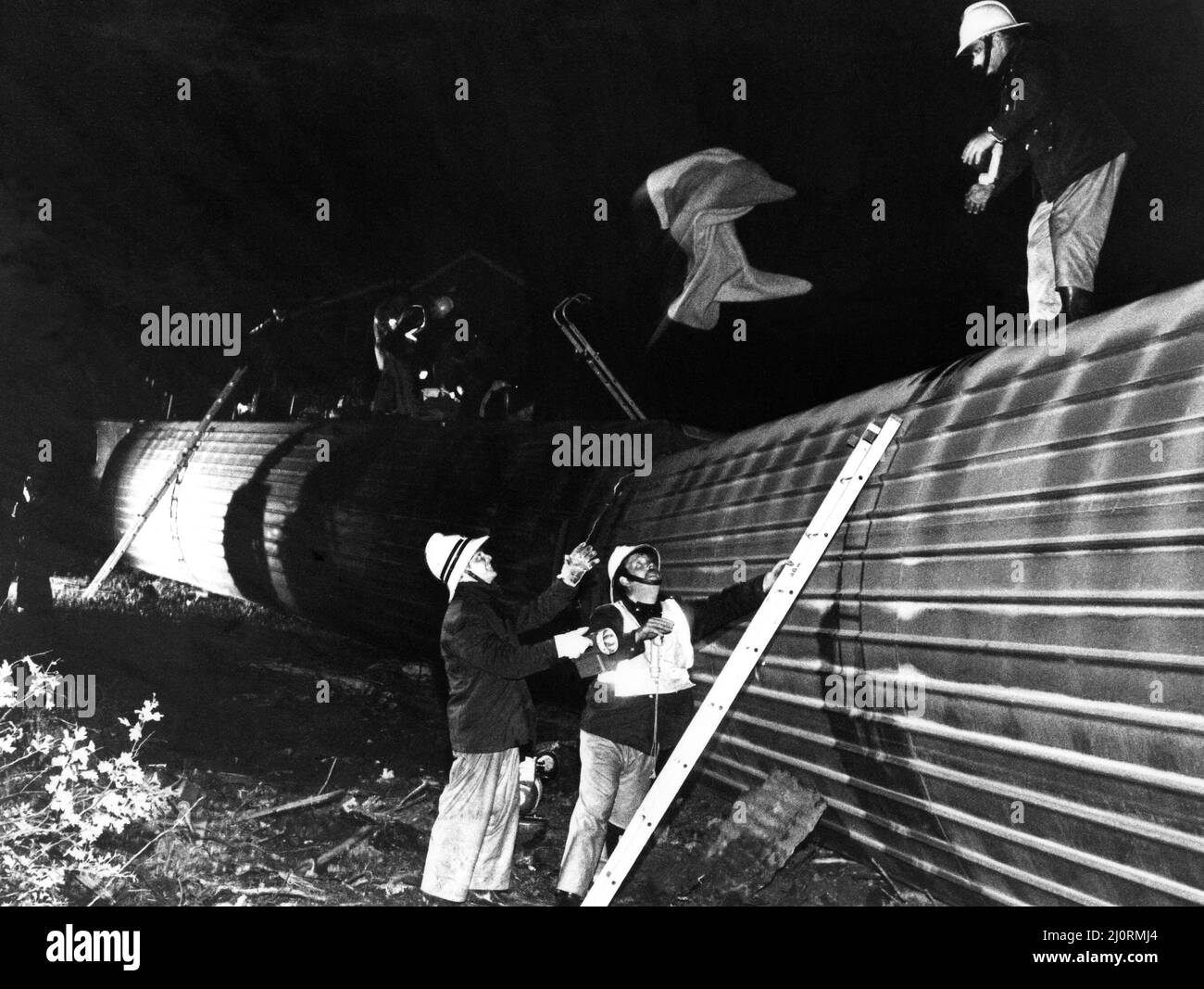 The crash of the Aberdeen to London sleeper train which careered off the track on the notorius Morpeth curve, just half a mile from the station. The crash happened at 10 minutes past midnight on 24th June, 1984   The scene at Morpeth as the emergency services check the overturned carriages Stock Photo