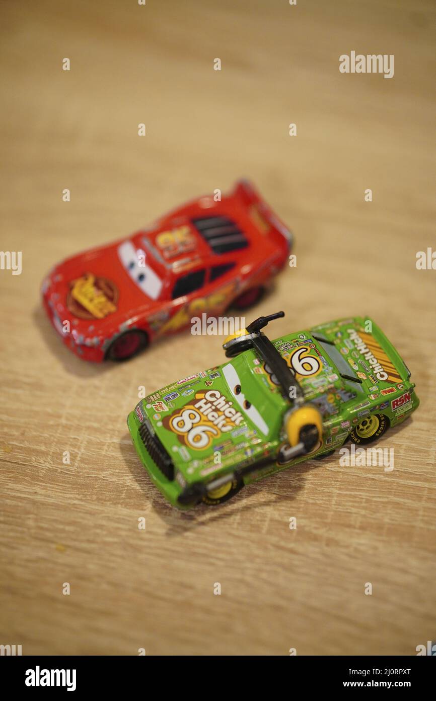 Vertical shot of Mattel Disney Pixar Chick Hicks and Lightning McQueen toy model race cars Stock Photo