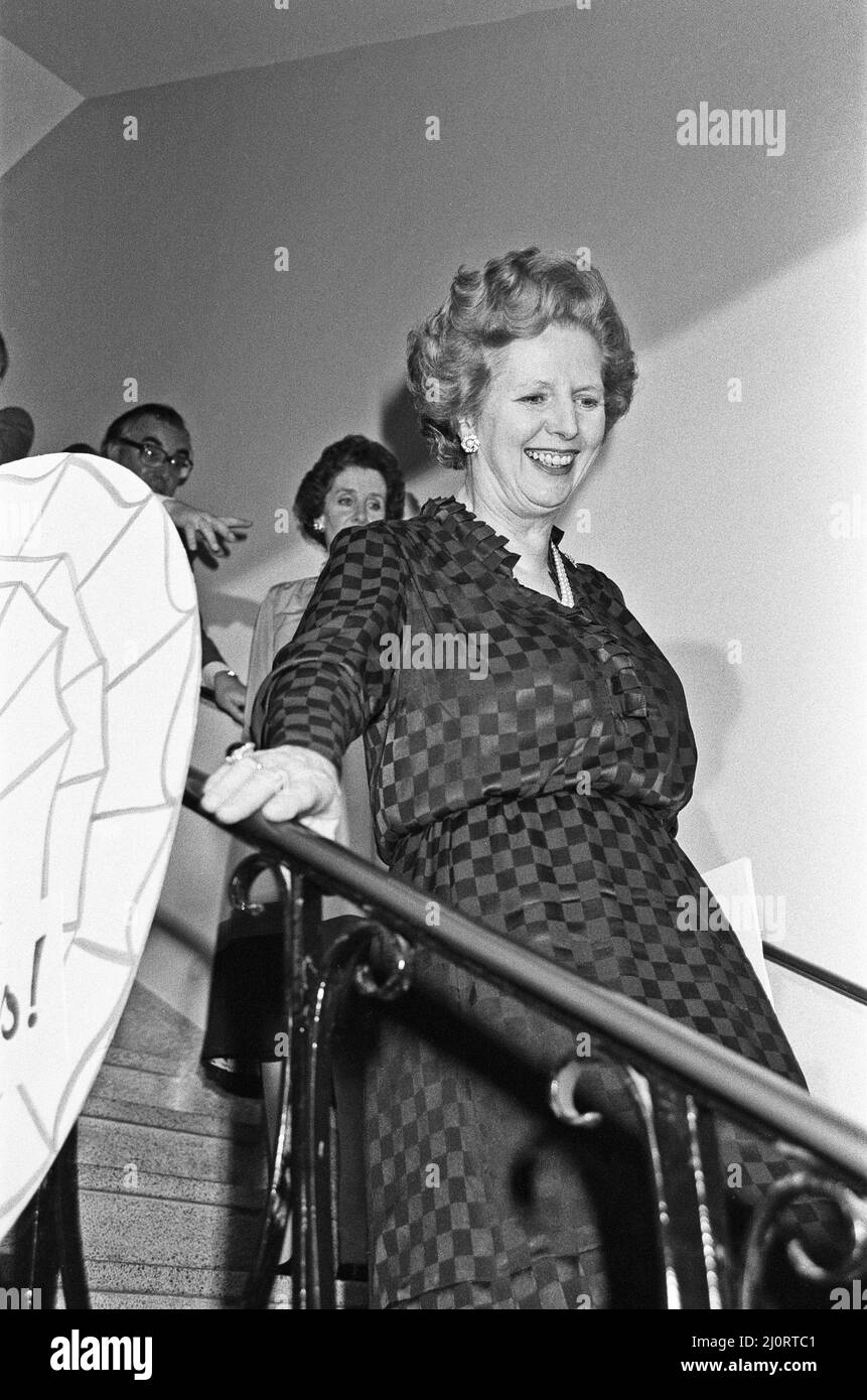 Prime Minister Margaret Thatcher celebrates at Conservative party headquarters after winning the General Election. Mr. Thatcher holds large button that reads, 'Conservative Victory, 9th June. Congratulations, Maggie in.'10th June 1983 Stock Photo