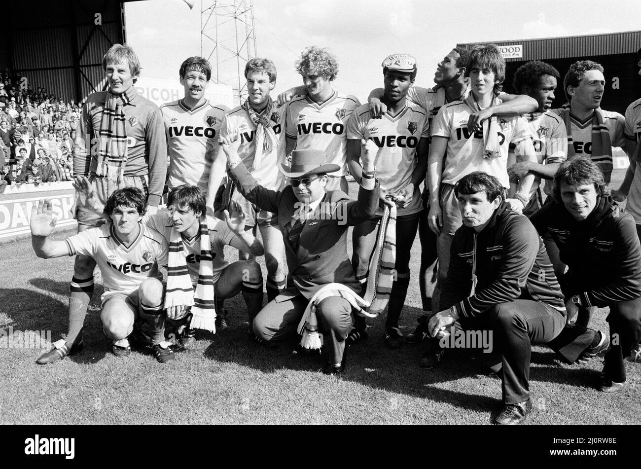 Elton John and the Watford side pose for the photographers after their match against Liverpool. 14th May 1983. Stock Photo