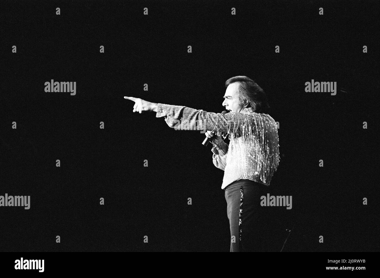 American singer Neil Diamond in concert at the NEC Arena, Birmingham. 2nd July 1984. Stock Photo