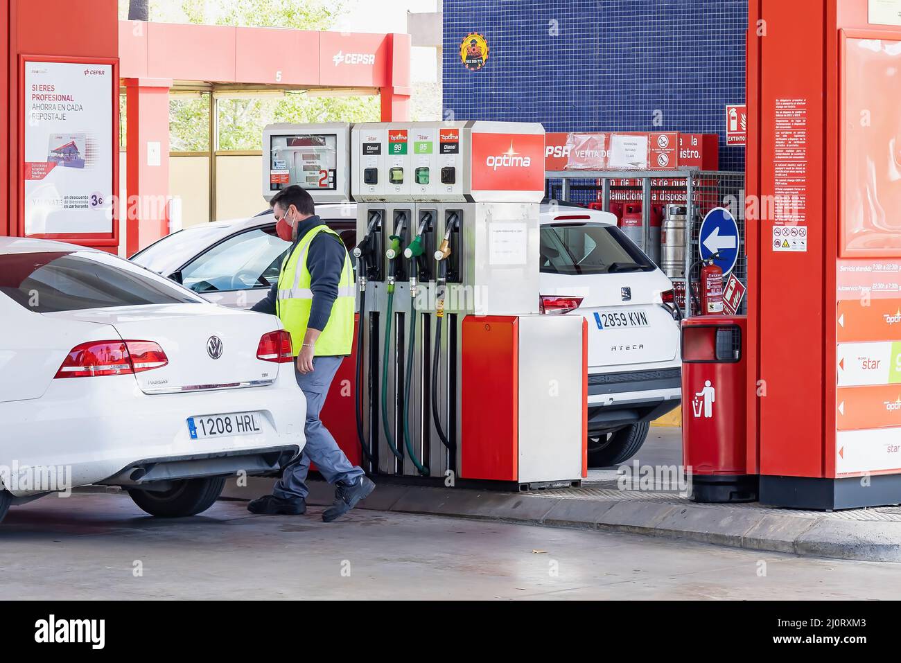 Huelva, Spain - March 10, 2022: View of a petrol pump at a Cepsa gas station with a car that is refueling Stock Photo