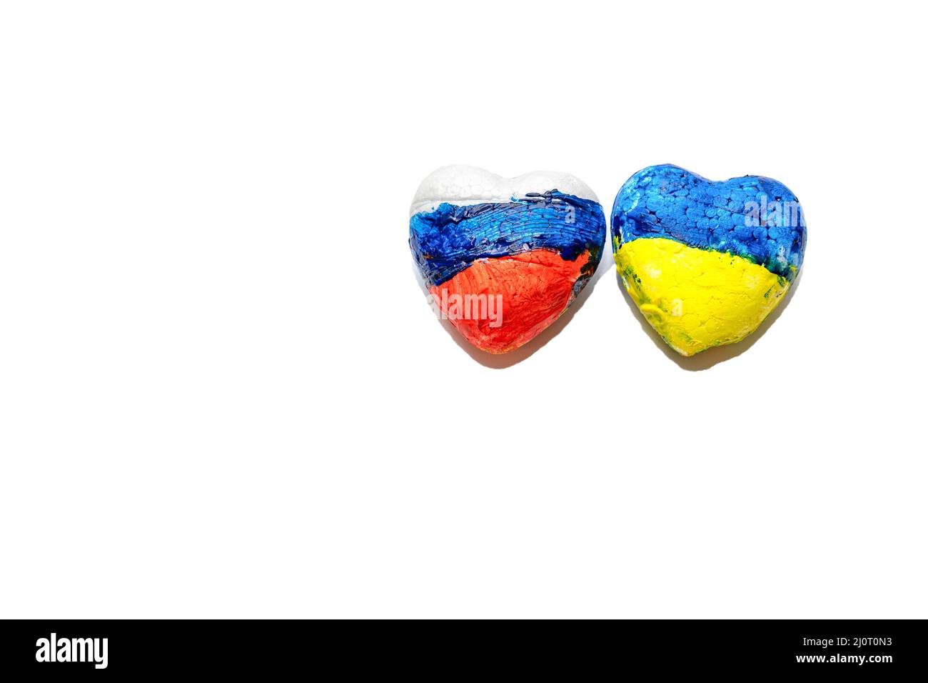 National flags of Ukraine and Russia on heart shape. Creative isolated image about peace between Ukrainian and Russian people, talks, Negotiation. Stock Photo