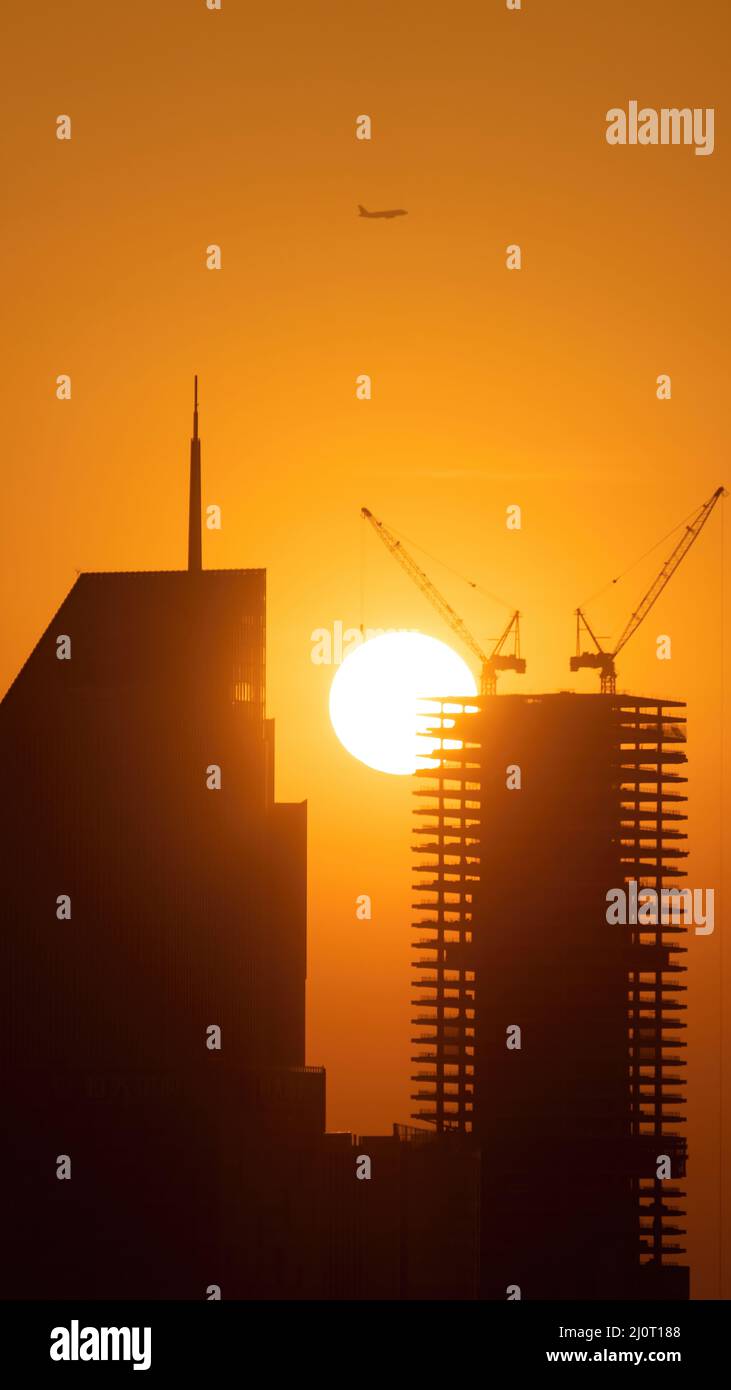 Building Completed Sunset Mesmerizing sunset sun seen from the background of a modern uncompleted ...
