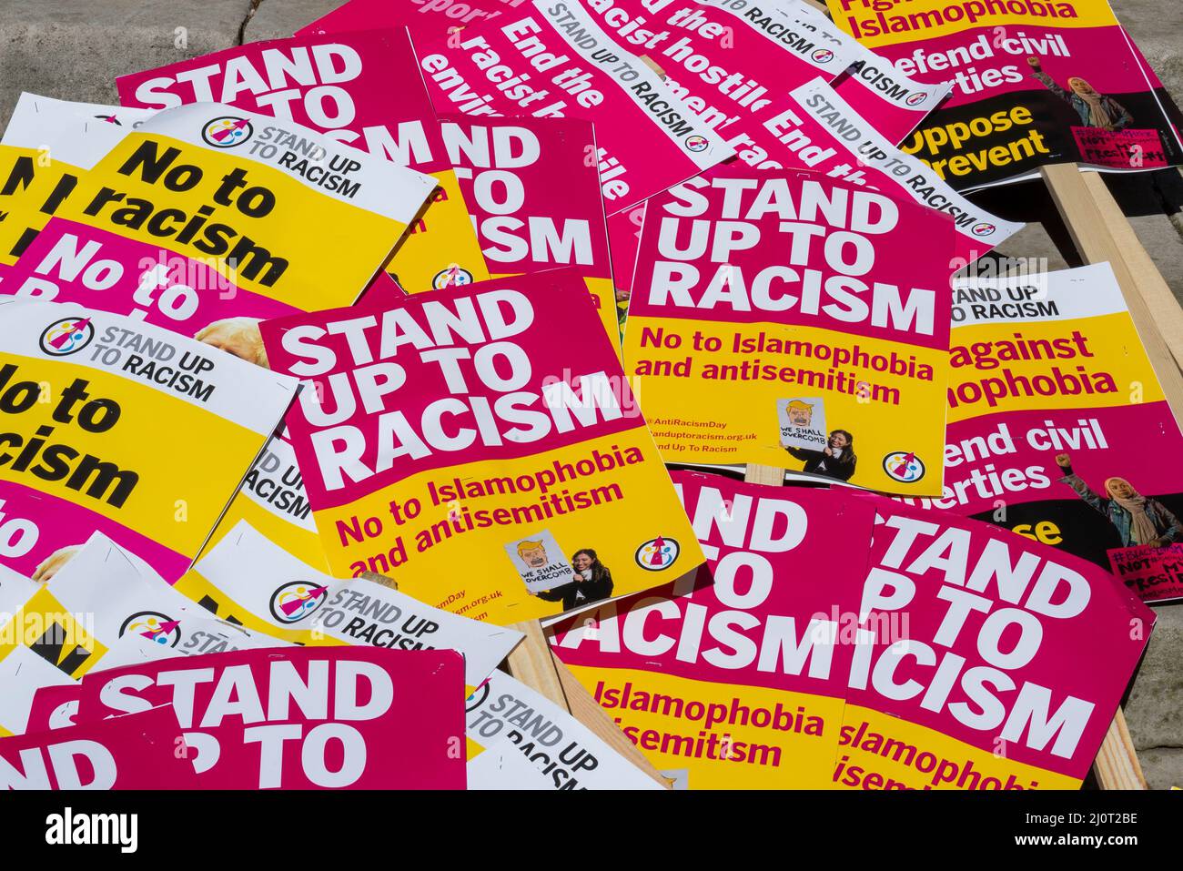 Protest taking place in London on UN Anti Racism Day. Stand up to racism placards ready for the rally Stock Photo