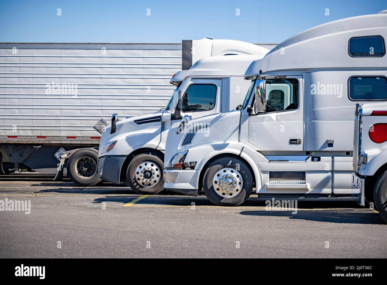 Profiles of different white industrial long haul big rigs semi trucks ...