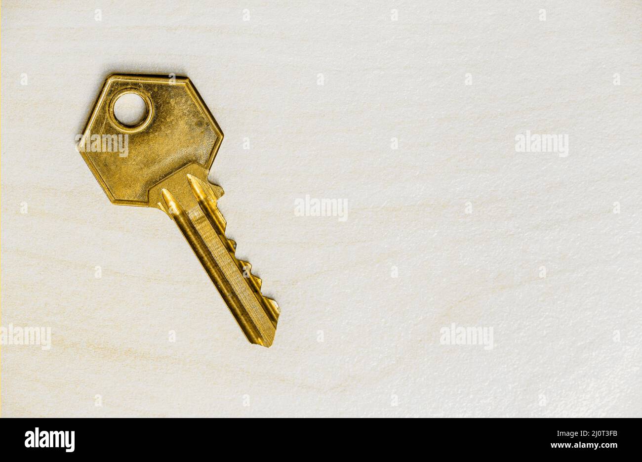 Old golden retro house key, property business, real estate background ...