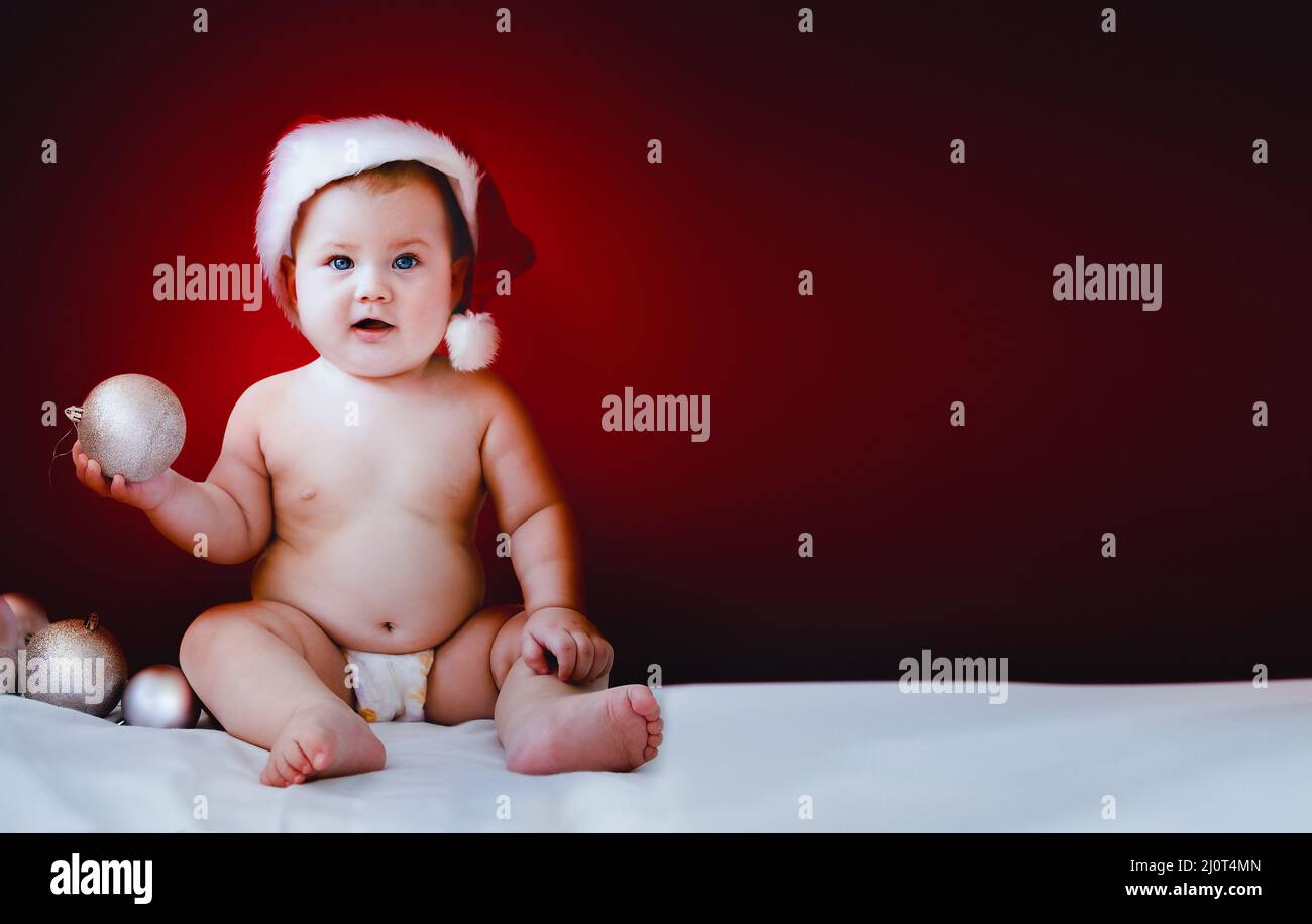 Cute Baby in Santa Hat Stock Photo