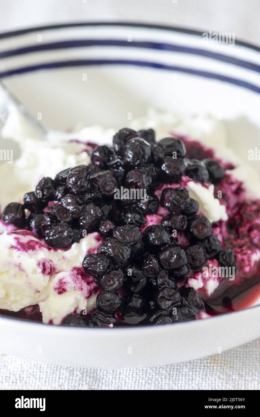 Close up of blueberry ice cream in plates Stock Photo