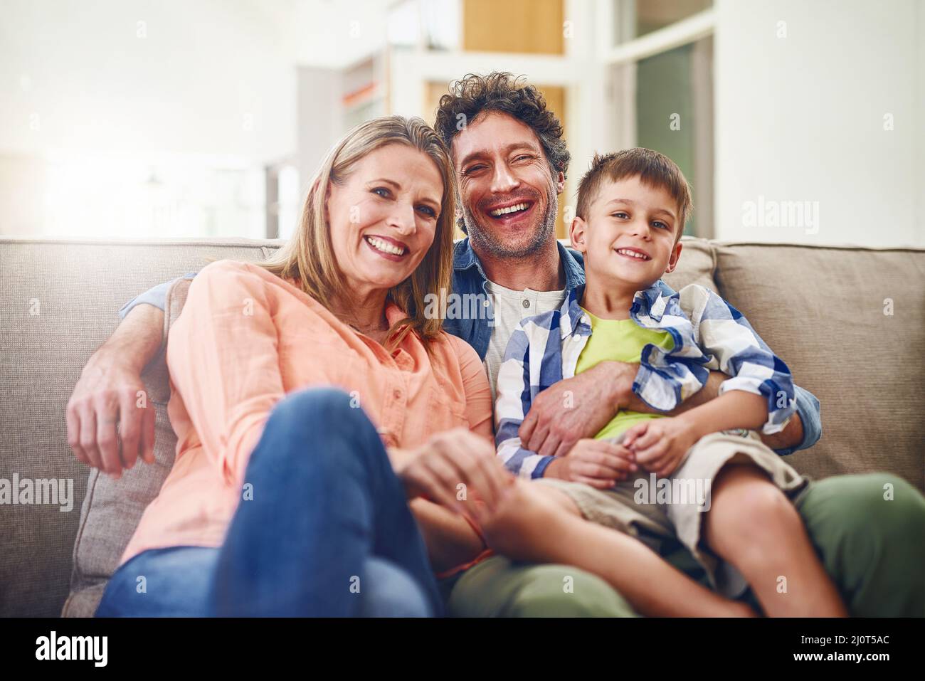 The love of a family. Portrait of a happy family bonding together at home. Stock Photo