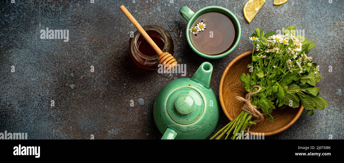 Herbal tea with natural healing medical herbs, tea cup, tea pot top