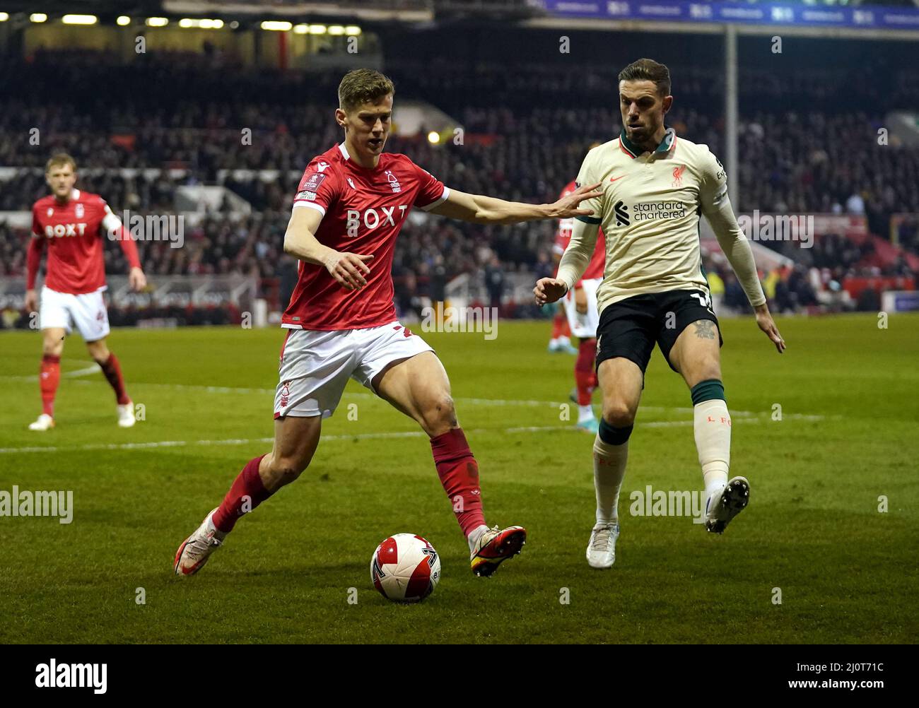 Nottingham Forest's Ryan Yates (left) and Liverpool's Jordan Henderson  battle for the ball during the Emirates FA Cup quarter final match at the  City Ground, Nottingham. Picture date: Sunday March 20, 2022
