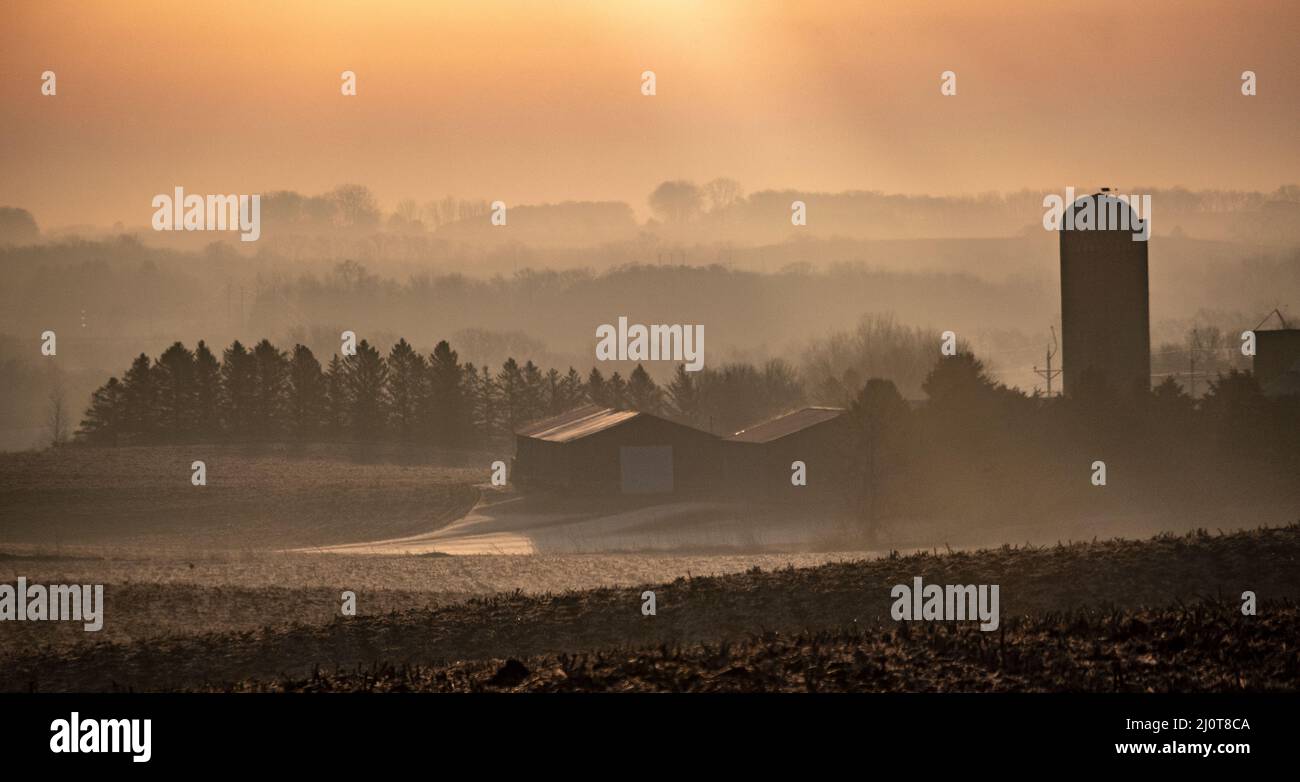 Sunrise over a farm in the American Midwest in early spring Stock Photo