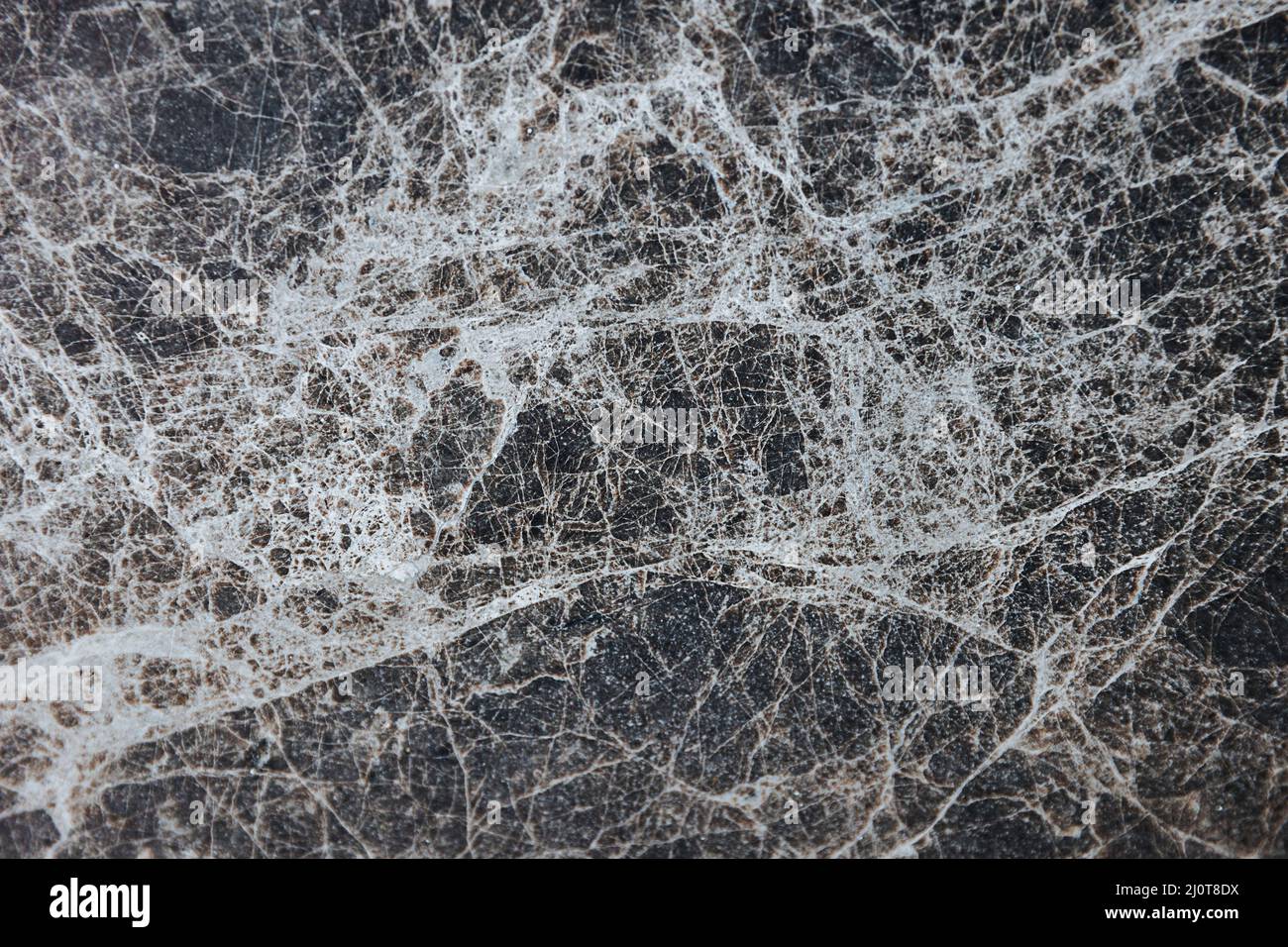 Black marble background. Black marble wallpaper and counter tops. Black marble floor and wall tile. Black marble texture. Natural granite stone. Stock Photo
