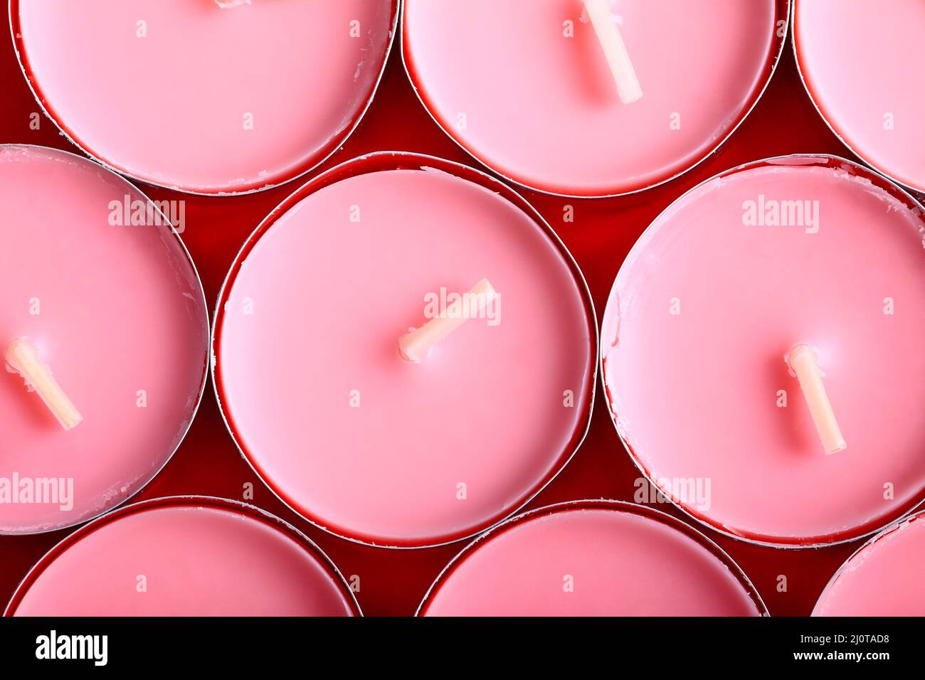 Flat lay view of pink wax tea light candles Stock Photo Alamy