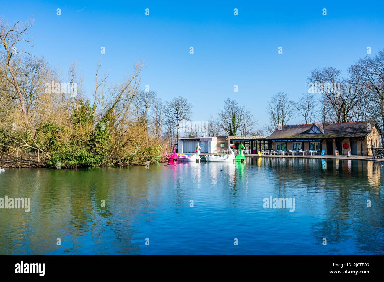 LONDON, UK - MARCH 19, 2022: View of boating lake with Lakeside Café and pedal boats on at Alexandra Palace in London Stock Photo