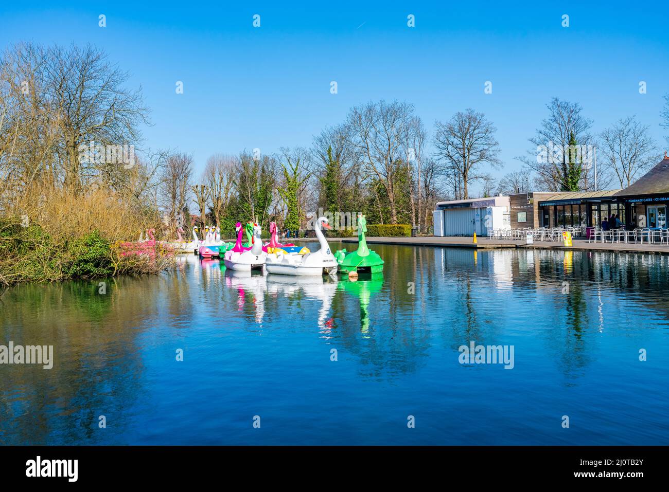 LONDON, UK - MARCH 19, 2022: View of boating lake with Lakeside Café and pedal boats on at Alexandra Palace in London Stock Photo