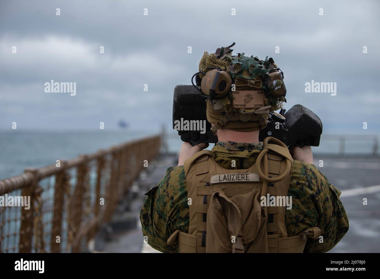 U.S. Marine Corps Lance Cpl.  Joshua Lauziere, an antitank missile man assigned to the 22nd Marine Expeditionary Unit (MEU), looks through the javelin guidance system during Composite Training Exercise (COMPTUEX) aboard amphibious docking landing ship USS Gunston Hall (LSD 44), Jan. 22, 2022. The 22nd MEU is underway for Composite Training Unit Exercise (COMPTUEX) in preparation for an upcoming deployment. COMPTUEX is the last at-sea period in the MEU’s Predeployment Training Program; it aims to test the capabilities of the Navy Marine Corps team and achieve deployment certification.  (U.S. Ma Stock Photo