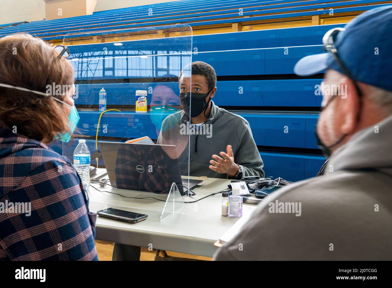 Princeton, KY, January 22, 2022 -- FEMA Hazard Mitigation Specialist Clifford Miller talks to tornado survivors at a Disaster Recovery Center. The tornado devastated the town in early December. Photo by Liz Roll/FEMA Stock Photo