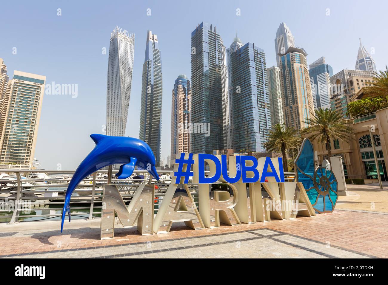 Dubai Marina Logo and Harbour Skyline Architecture Luxury Vacation in Arabia Stock Photo