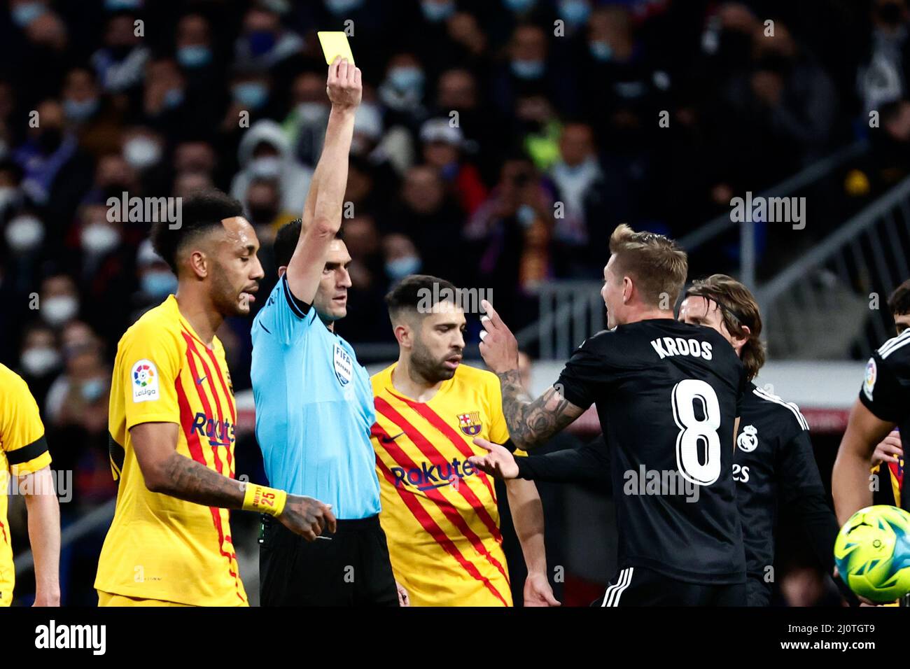 MADRID, SPAIN - MARCH 20: Referee Juan Martinez Munuera gives a yellow card to Toni Kroos of Real Madrid during the Spanish La Liga Santander match between Real Madrid and FC Barcelona at Estadio Santiago Bernabéu on March 20, 2022 in Madrid, Spain (Photo by DAX Images/Orange Pictures) Credit: Orange Pics BV/Alamy Live News Stock Photo