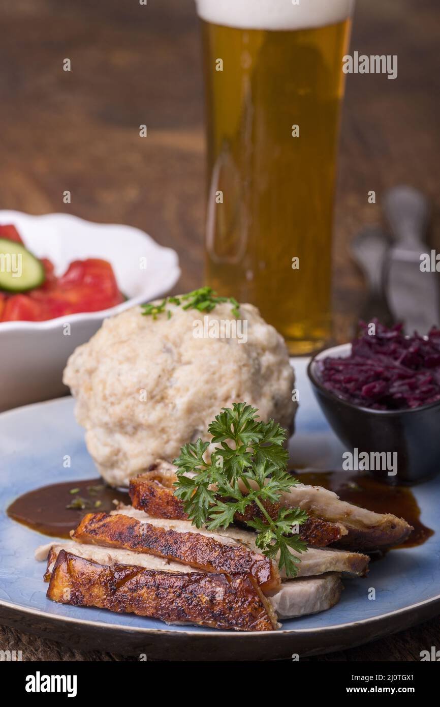 Bavarian roast pork with bread dumpling Stock Photo