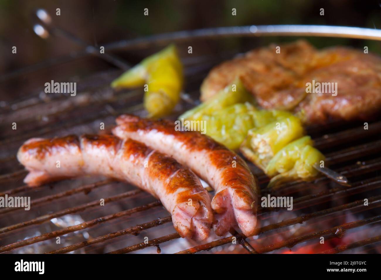Grilled sausages on the grill Stock Photo