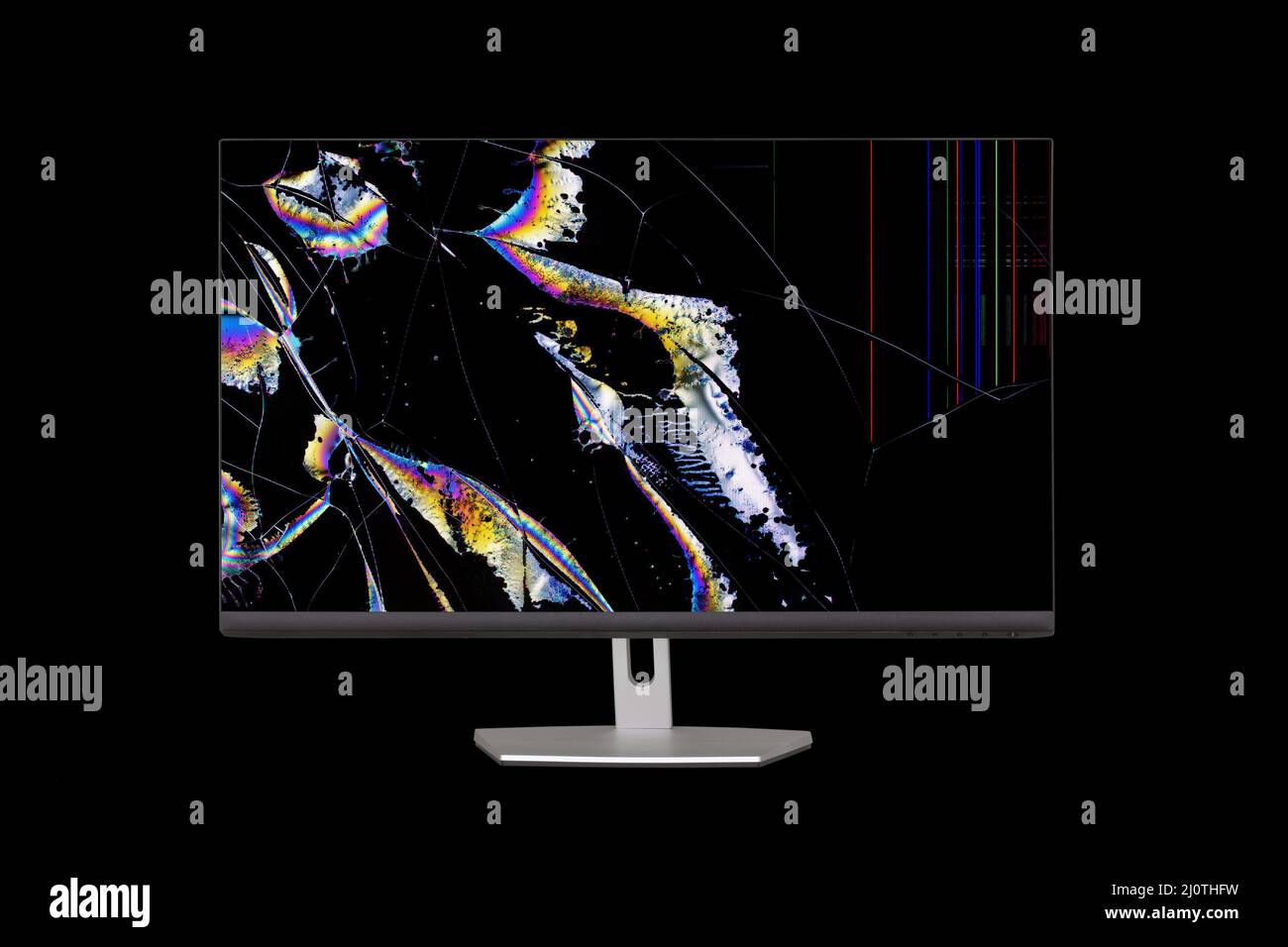 Flowing crystals in the form of colored stripes and cracks on the broken screen of a liquid crystal display computer monitor  is Stock Photo