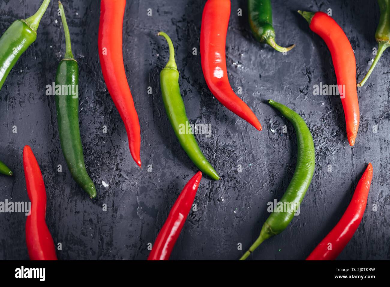 Selection of raw chili peppers. Group of red and green peppers. Hot and