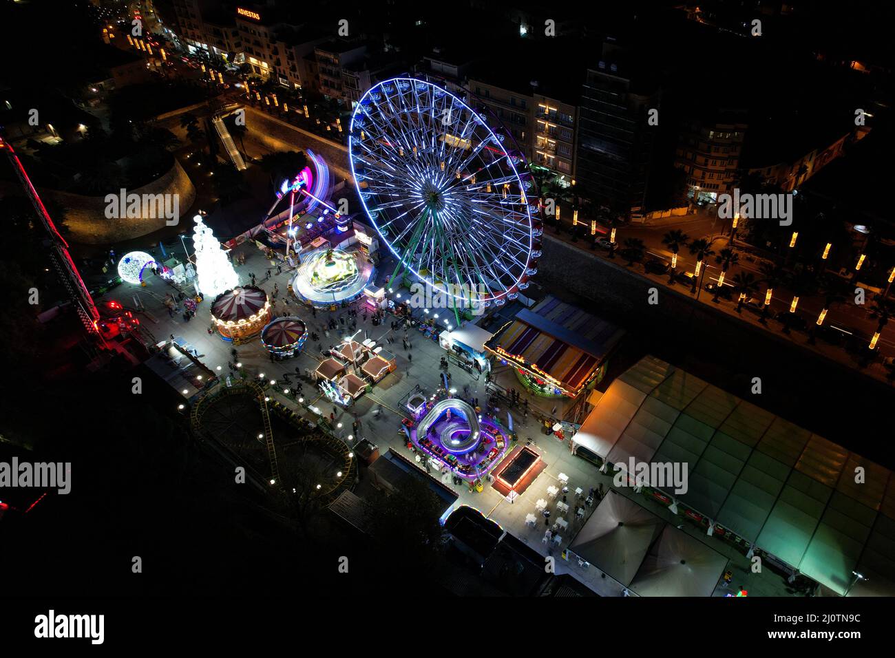 Aerial drone photograph of an amusement park with illuminated games at Christmas. Nicosia Cyprus Stock Photo