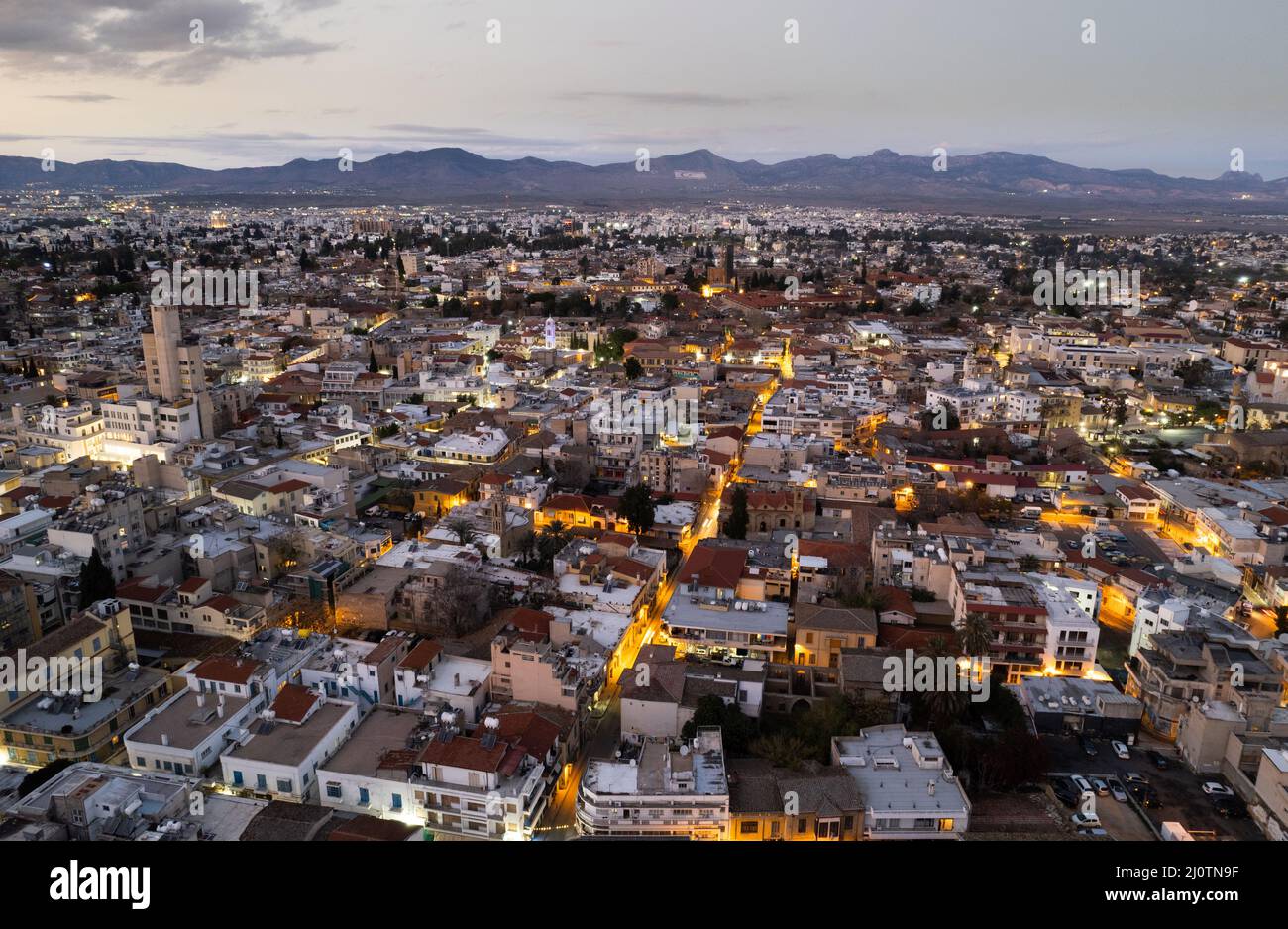 Aerial drone photograph of cityscape of Nicosia town in Cyprus at sunset. Stock Photo