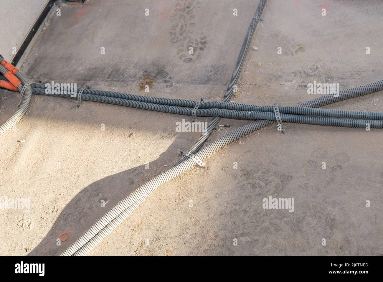 Plastic pipes on a construction site for electrical installations Stock Photo