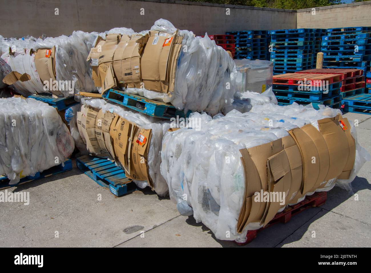 Plastic bundled for recycling awaiting pickup Stock Photo