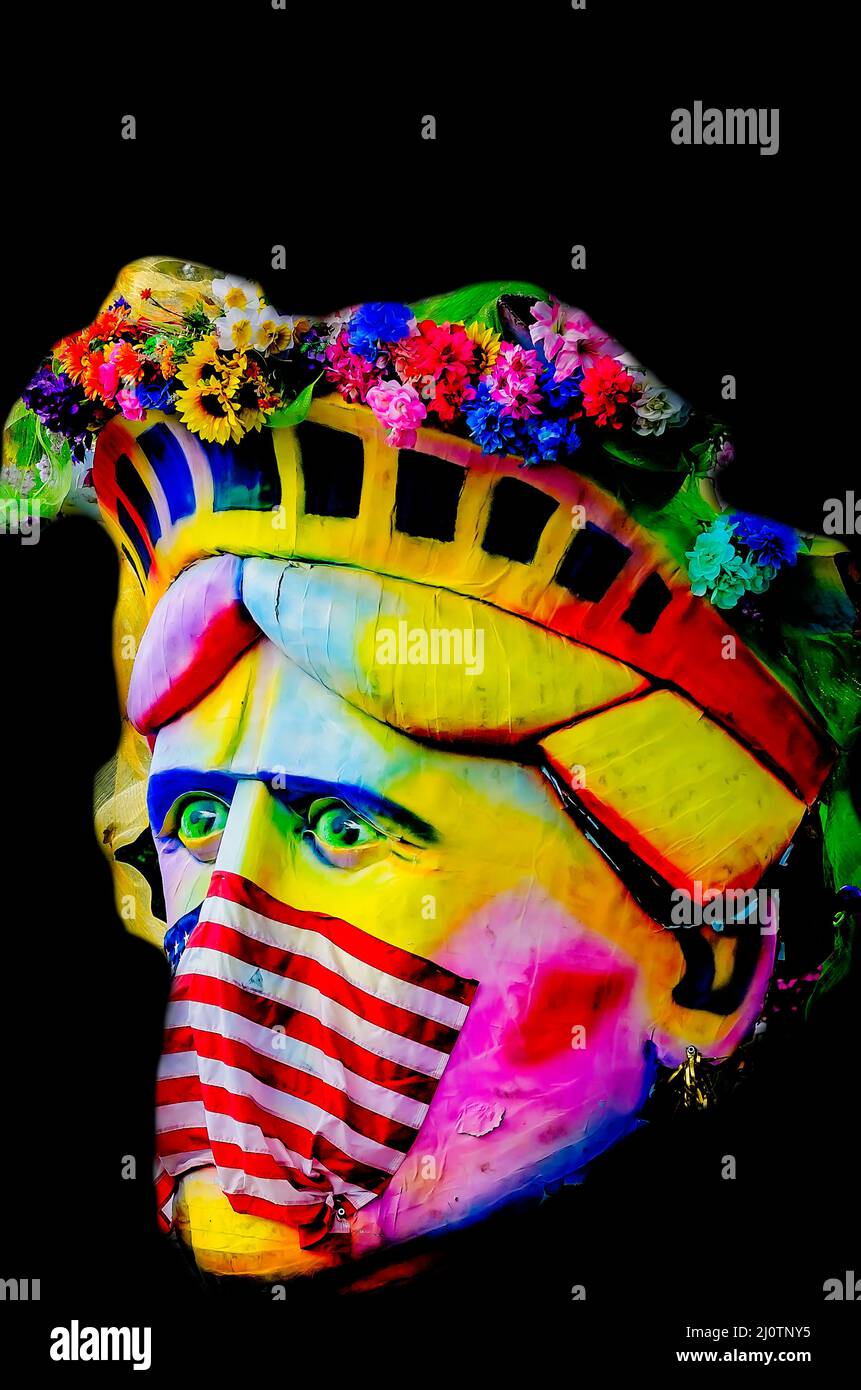 The Statue of Liberty wears an American flag as a COVID mask and muzzle, March 5, 2022, in Mobile, Alabama. Stock Photo