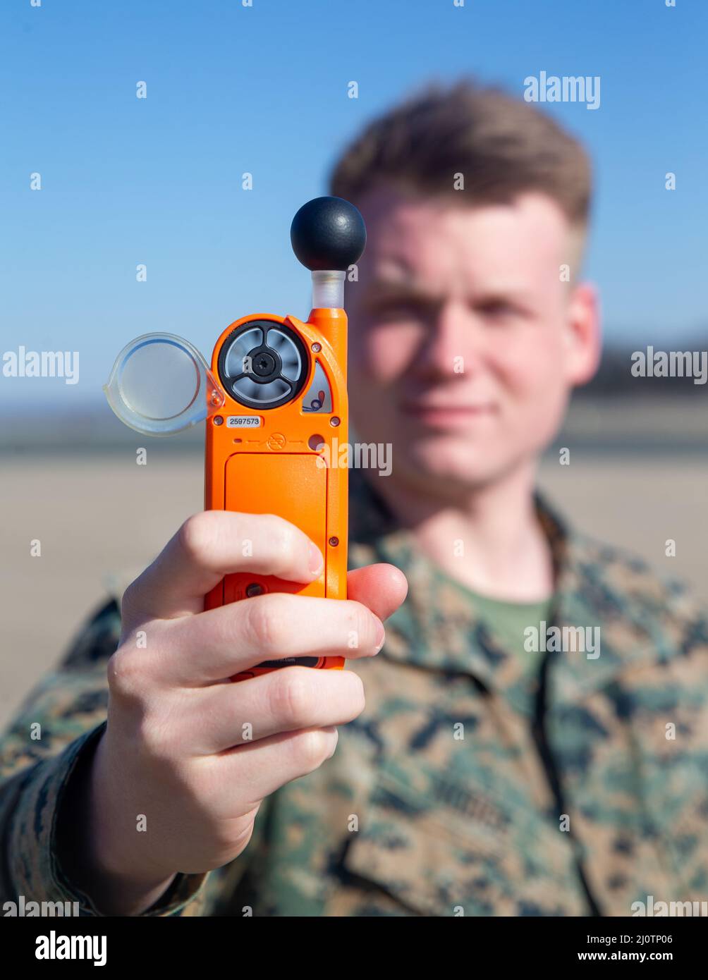 U.S. Marine Corps Lance Cpl. Chandler A. Hodge, a meteorology and oceanography (METOC) analyst forecaster with Marine Corps Air Facilities Quantico, reads information off a kestrel weather meter at Marine Corps Base Quantico, Virginia, Jan. 26, 2022. This device reads the wet bulb globe temperature, pressure, and humidity, and is used in tactical situations, or when the weather conditions need to be known on the spot. (US Marine Corps photo by Lance Cpl. Kayla LaMar) Stock Photo