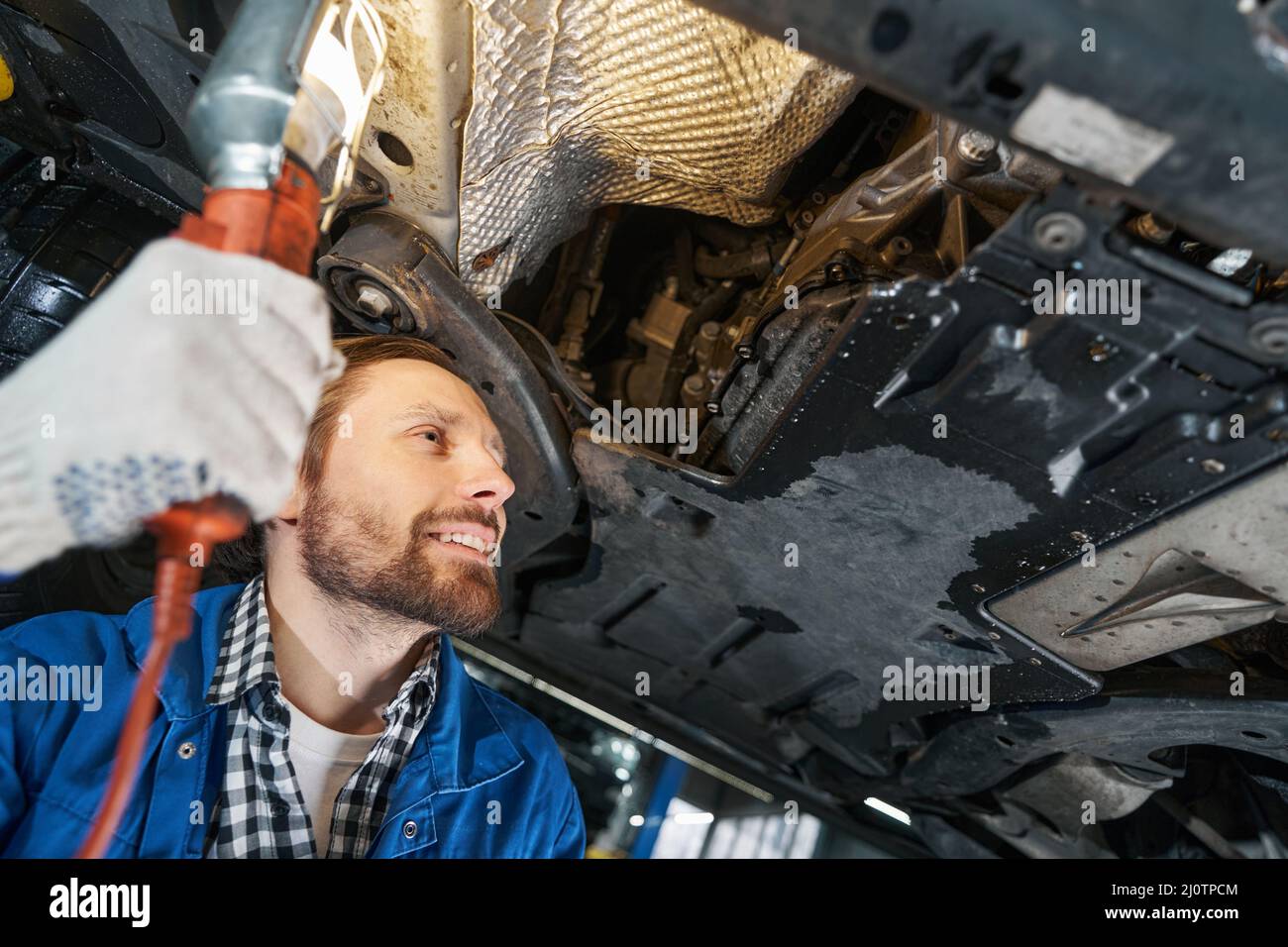 The Car Mechanic Unscrews The Diesel Filter Next To The Oil Pan With A  Metal Wrench Visible Man Hands Stock Photo - Download Image Now - iStock