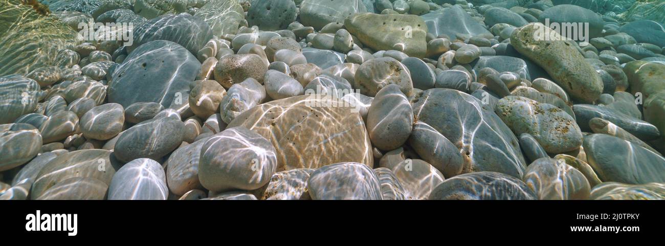 Pebbles and rocks under water in the sea, natural scene, Mediterranean sea, Spain Stock Photo