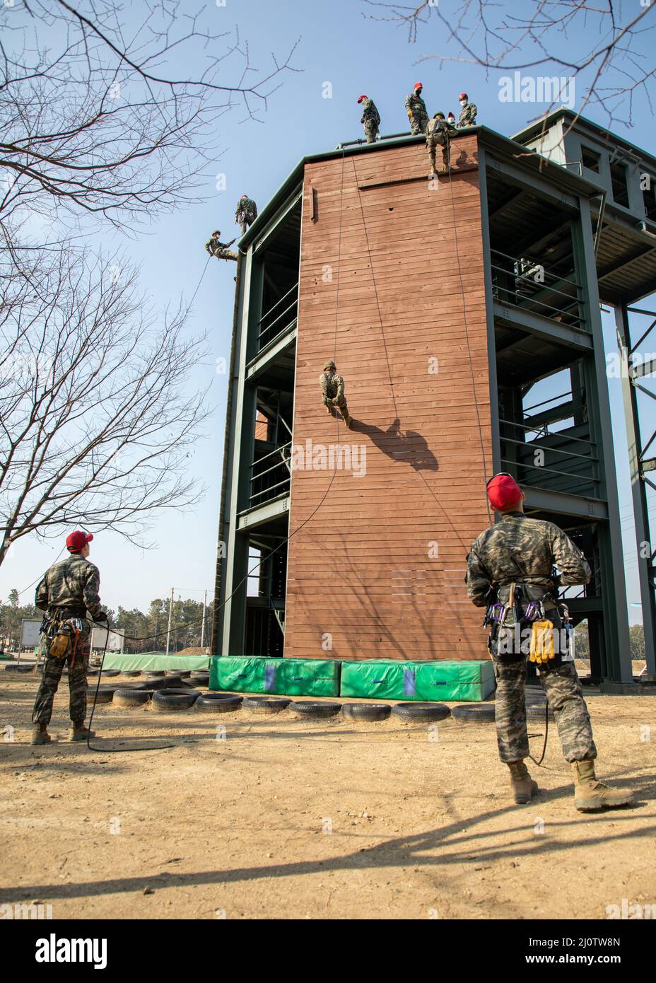 U.S. Marines with U.S. Marine Corps Forces Korea and 3D Sustainment Group (Experimental), 3D Marine Logistics Group rappel during a ropes course with Republic of Korea Marine Corps Ranger School in Pohang, South Korea, Jan. 27, 2022. The course increased the Marines’ readiness with rappelling and rope work while improving interoperability with our partners and allies. (U.S. Marine Corps photo by Sgt. Ash McLaughlin) Stock Photo