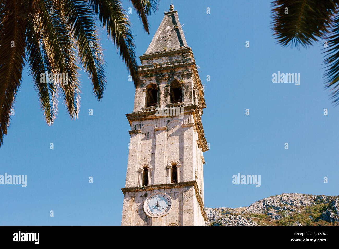 Bell tower with the clock of the Church of St. Nicholas. Montenegro Stock Photo