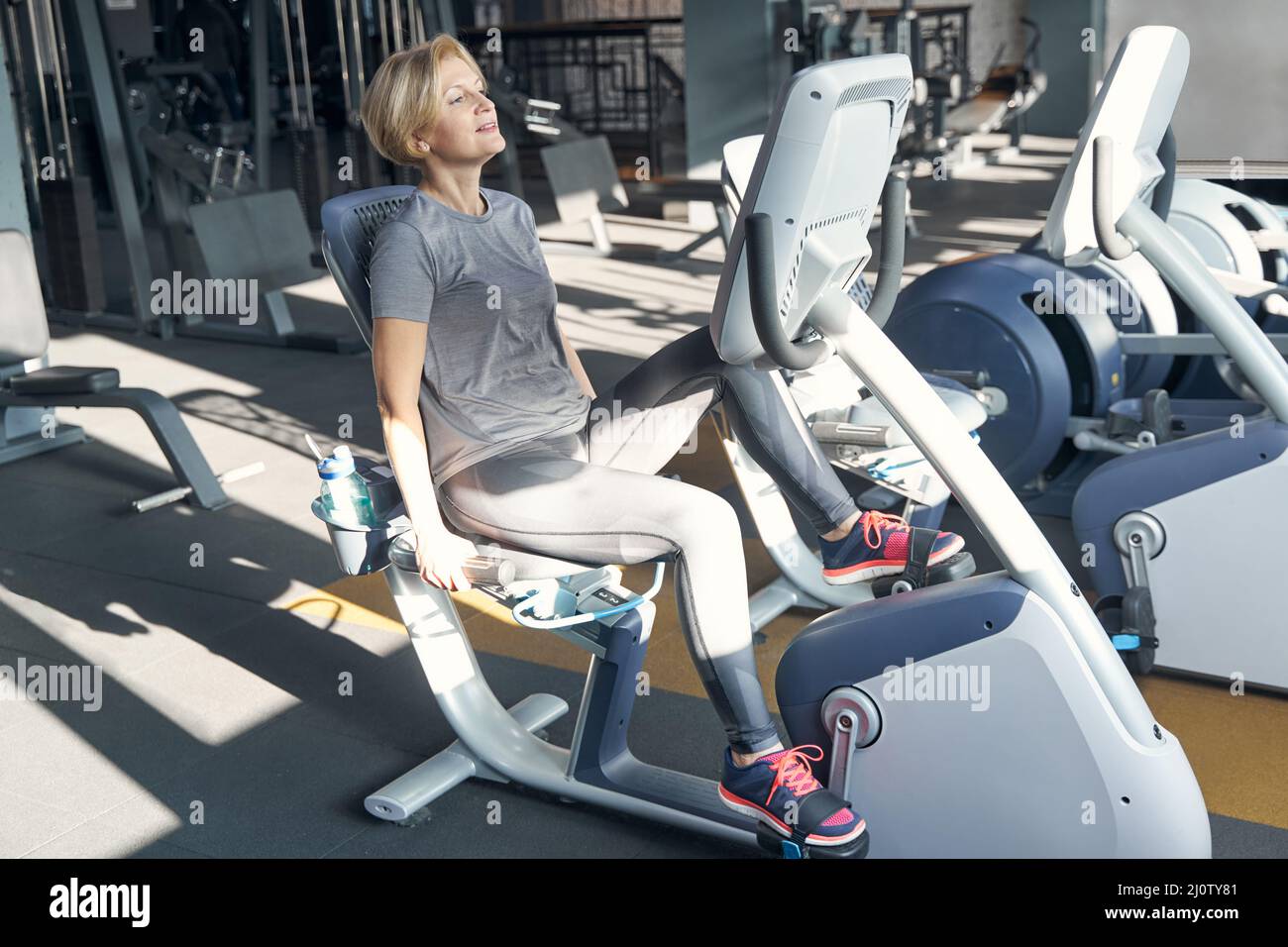 Woman using stepper training machine hi-res stock photography and ...